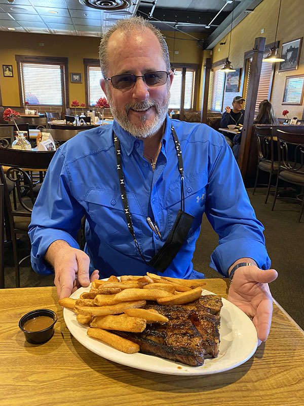 Trace Welch, owner of Mickey’s Top Sirloin with the house special Porterhouse