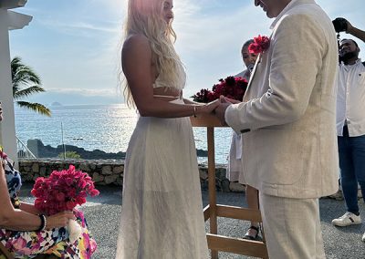 Kaylee, Rayner exchanging vows at sunset